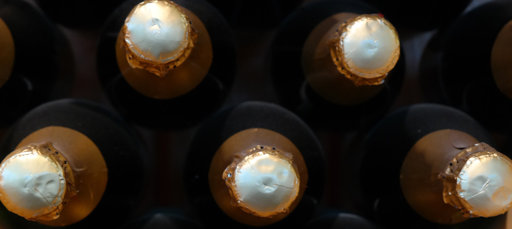 Producer working with Cava bottles in the cellar
